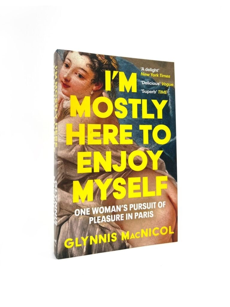 I'm Mostly Here to Enjoy Myself - One Woman's Pursuit of Pleasure in Paris by MacNicol, Glynnis — book cover